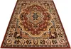 A Persian-style rug with intricate patterns in shades of brown, beige, and black, laid out on a white background. Voir les images du produit
