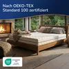 Bett mit der Matratze in einem Schlafzimmer mit Kamin und Waldblick Produktbild-Vorschau