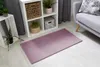 Weicher Hochflor-Teppich in der Farbe Lavendel ausgelegt im Wohnzimmer.
 Produktbild-Vorschau