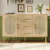 A wooden sideboard with cane detailing and gold legs, set against a light green wall and a white rug. Podgląd zdjęcia produktu