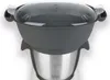 A close-up shot of a kitchen appliance, specifically a thermo-multicooker, with its lid on. Produktbild-Vorschau