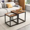 A living room scene with a couch and nesting coffee tables. Podgląd zdjęcia produktu