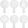 Six white coffee stencils with Christmas-themed designs arranged in two rows of three. Náhled obrázku produktu