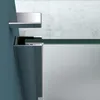A close-up view of a shower enclosure's corner, showing the glass and metal frame. Produktbild-Vorschau
