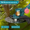 Close-up of a teal and pink electric trimmer with a spinning silver blade, cutting through a tree branch. Green leaves and branches form the background. Produktbild-Vorschau
