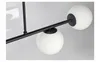 Close-up of a black chandelier with white glass globes. Produktbild-Vorschau