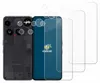 A black smartphone with its back panel removed, showing internal components, is placed next to several clear screen protectors. The screen protectors are layered on top of each other, with the front of a phone visible behind them. The phone has a distincti Produktbild-Vorschau