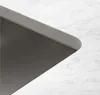 A close-up view of a sink edge and countertop. Produktbild-Vorschau