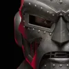 A close-up of a metallic mask with a red glow. Anteprima dell’immagine prodotto