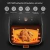 An air fryer with a chicken inside, showing its heating mechanism and features. Produktbild-Vorschau