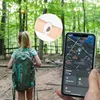 A young girl with a backpack in a forest, with a phone showing a map and a close-up of a wristband. Náhľad obrázku produktu
