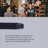 People in a casual office or co-working space, with a close-up of a belt in the foreground. Anteprima dell’immagine prodotto