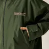 A close-up shot of a person's hand in the pocket of a green jacket. Produktbild-Vorschau