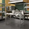 A commercial kitchen with stainless steel appliances and shelving. Produktbild-Vorschau