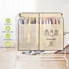 A fabric cover for a clothing rack, with text and icons describing its features. Produktbild-Vorschau