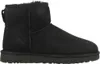 A black UGG boot is shown from the side against a white background. Voir les images du produit