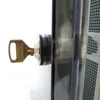 A close-up of a key inserted into a lock mechanism. Produktbild-Vorschau