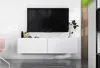 A modern white TV stand with a large black TV mounted above it, decorated with a few items. Produktbild-Vorschau