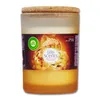 A scented candle in a glass jar with a cork lid. Voir les images du produit