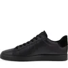 A side view of a black leather sneaker against a white background. Voir les images du produit