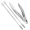 A set of stainless steel seafood tools, including a crab cracker and two small forks, laid out on a white background. Podgląd zdjęcia produktu