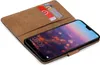A brown book-style phone case with a Huawei P20 smartphone inside, showing the lock screen. Anteprima dell’immagine prodotto