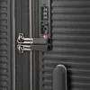 A close-up view of a black suitcase lock and handle. Produktbild-Vorschau