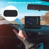 A person's hand on a car steering wheel with a small fan on the dashboard. A close-up of an anti-slip pad is shown in a circle on the left. Podgląd zdjęcia produktu