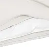 A close-up view of a cream-colored duvet cover with a white quilted insert visible. Produktbild-Vorschau