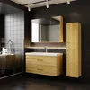 A modern bathroom with a wooden vanity, sink, mirror, and cabinet against a black tiled wall. Produktbild-Vorschau