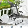 A grey folding chair is shown on a patio with a patterned rug underneath. The background shows a white railing and greenery. Produktbild-Vorschau