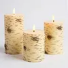 Three LED candles with a birch bark texture are displayed against a white background. Produktbild-Vorschau
