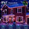 A house decorated with colorful Christmas lights during a snowy night. Produktbild-Vorschau