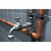 A close-up view of plumbing pipes and a faucet mounted on a tiled wall. Anteprima dell’immagine prodotto