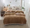 A bed with a brown comforter and pillows. Produktbild-Vorschau