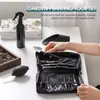 A person's hand is shown selecting a small shovel from a black tool bag, which is part of a garden planting tool set. Other items like a spray bottle and a soil container are visible on a white table. Náhled obrázku produktu