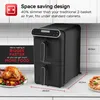 A black dual-basket air fryer is shown on a kitchen counter, with a roasted chicken and vegetables on a plate to the left and a pizza to the right. Text overlays highlight its space-saving design and capacity. Náhľad obrázku produktu