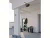 A security camera mounted on the ceiling of an outdoor porch. Produktbild-Vorschau