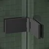 A close-up view of a black hinge connecting two glass panels of a shower enclosure. Podgląd zdjęcia produktu