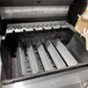 Inside view of a grill with heat deflectors installed. Podgląd zdjęcia produktu