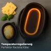 A close-up shot of a raclette grill with cheese and a potato, highlighting its heating element and food preparation. Produktbild-Vorschau