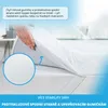 A hand is shown placing a white topper onto a mattress, highlighting its features. Náhled obrázku produktu