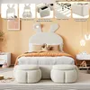 A child's bedroom with a bed featuring a bunny-shaped headboard and two storage ottomans. Produktbild-Vorschau