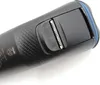 A close-up view of a black electric shaver with a silver trimmer attachment. Podgląd zdjęcia produktu