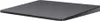 A dark gray Apple Magic Trackpad 2 is shown from a slightly elevated side angle against a white background. Produktbild-Vorschau