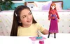 A young girl is playing with a doll and a toy fox in a bedroom setting. Produktbild-Vorschau