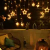 A balcony decorated with string lights shaped like stars and moons, a chair with cushions, and a bottle of champagne. Náhľad obrázku produktu