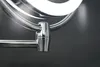 A close-up shot of a chrome makeup mirror's adjustable arm and mounting bracket against a dark gray background. Produktbild-Vorschau