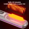 A close-up, angled view of a heated hair straightening brush, showing its internal heating elements and display screen. Produktbild-Vorschau