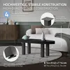 A living room scene with a coffee table and sofa, showcasing table legs. Produktbild-Vorschau